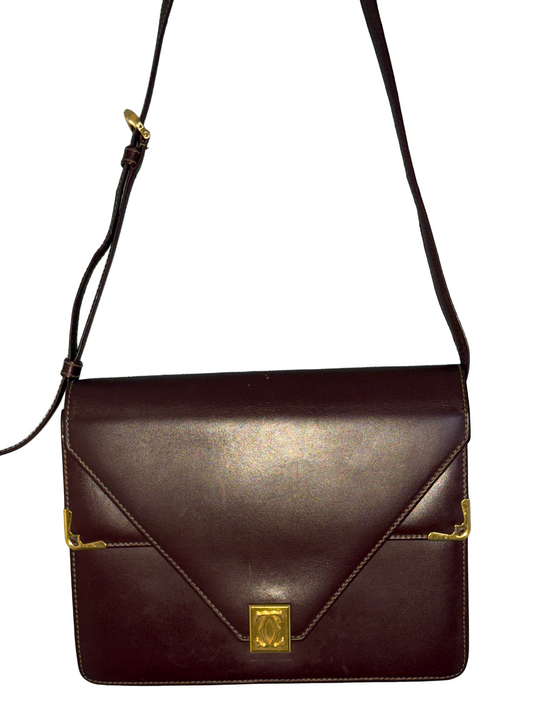 SAC CARTIER – MUST DE CARTIER EN CUIR BORDEAUX ET DÉTAILS DORÉS